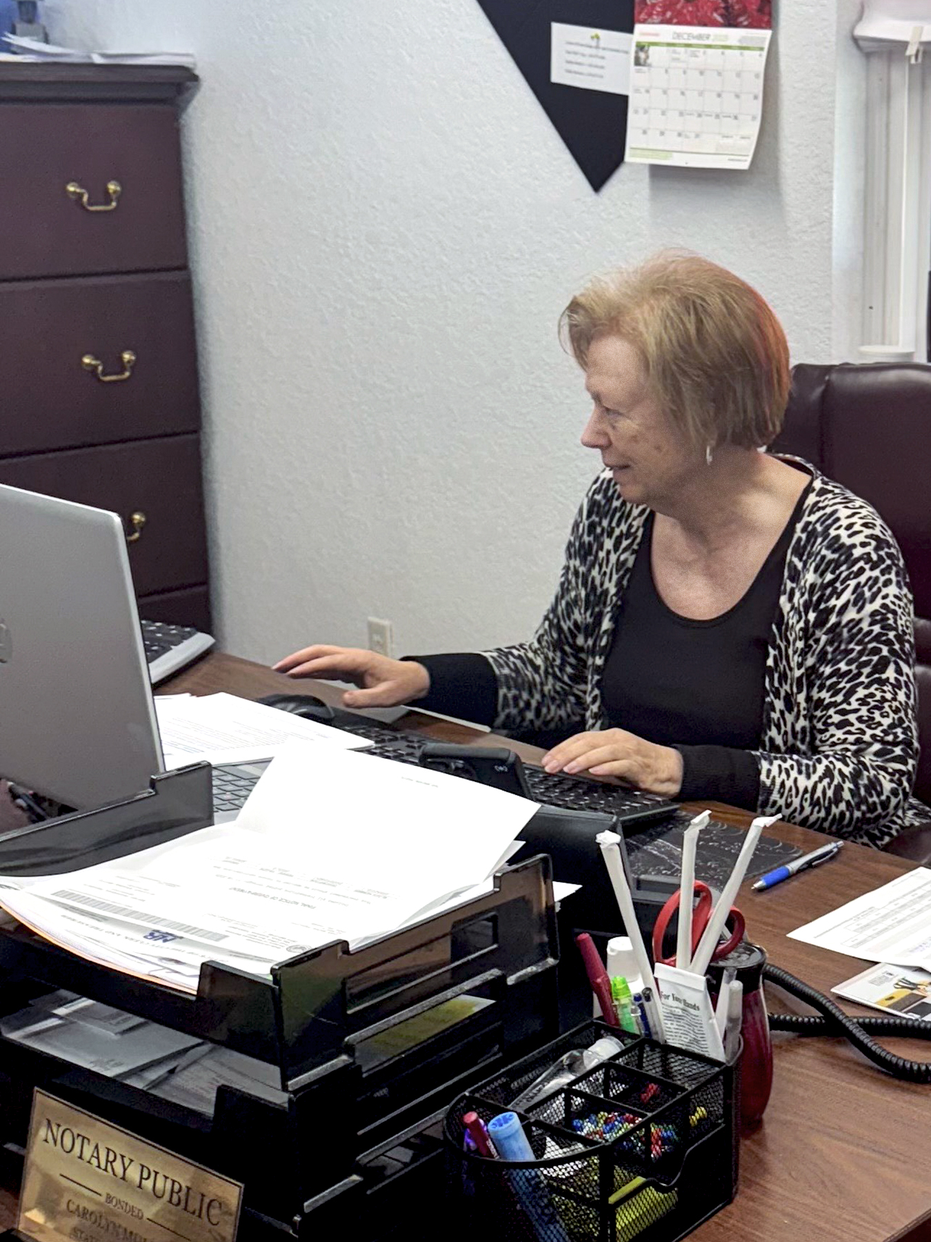 The Casa water clerk working at her desk.